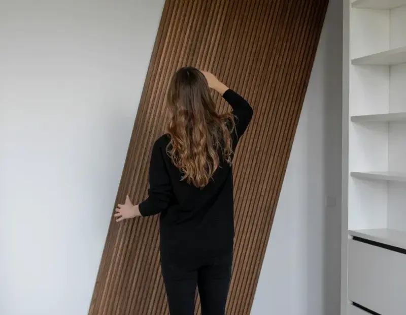 Wooden Slatted Panel Leaning on a White Wall - Minimalist Interior Decor Idea